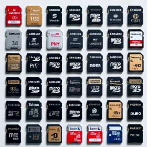 DALL·E 2024 06 10 10.20.02 A collection of various micro SD cards from different brands arranged neatly. Brands include SanDisk Lexar Samsung Kingston PNY Transcend Toshib